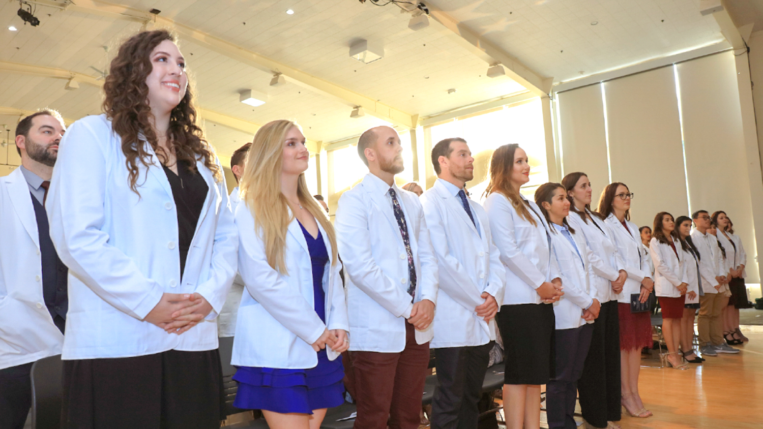 CSU Monterey Bay students in their white coats during the White Coat Ceremony