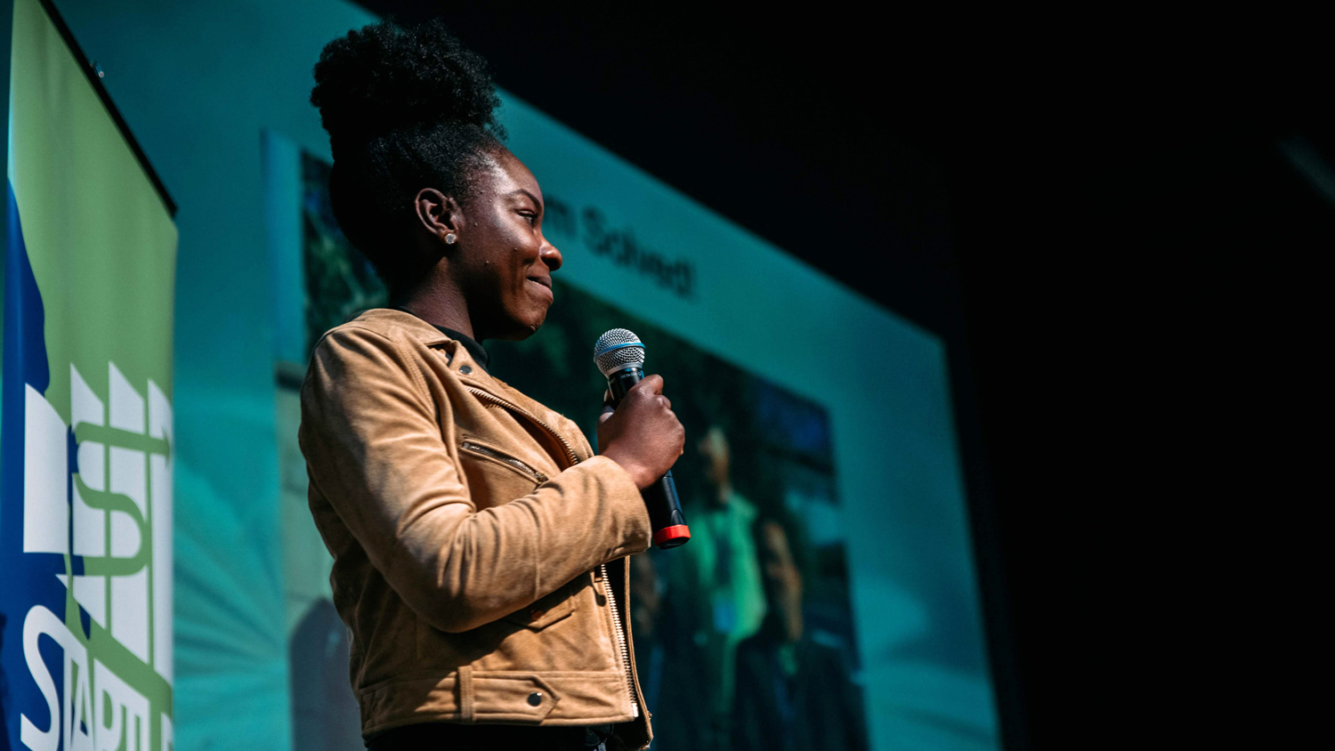 Student presenting on stage at the Startup Challenge