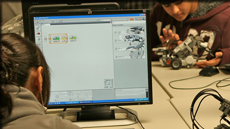 A student using robotics software