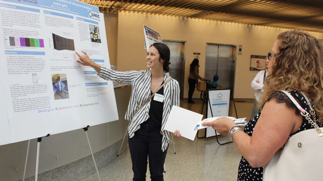 A student presenting her research