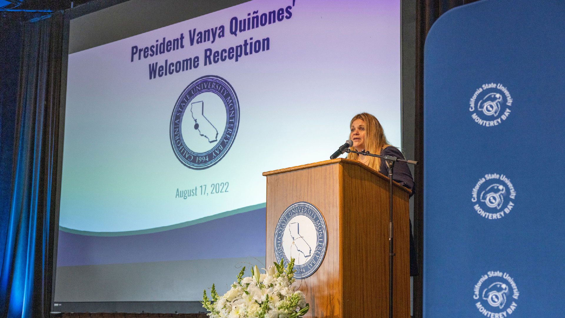 President Quiñones speaking at the podium at the Employee Welcome Reception