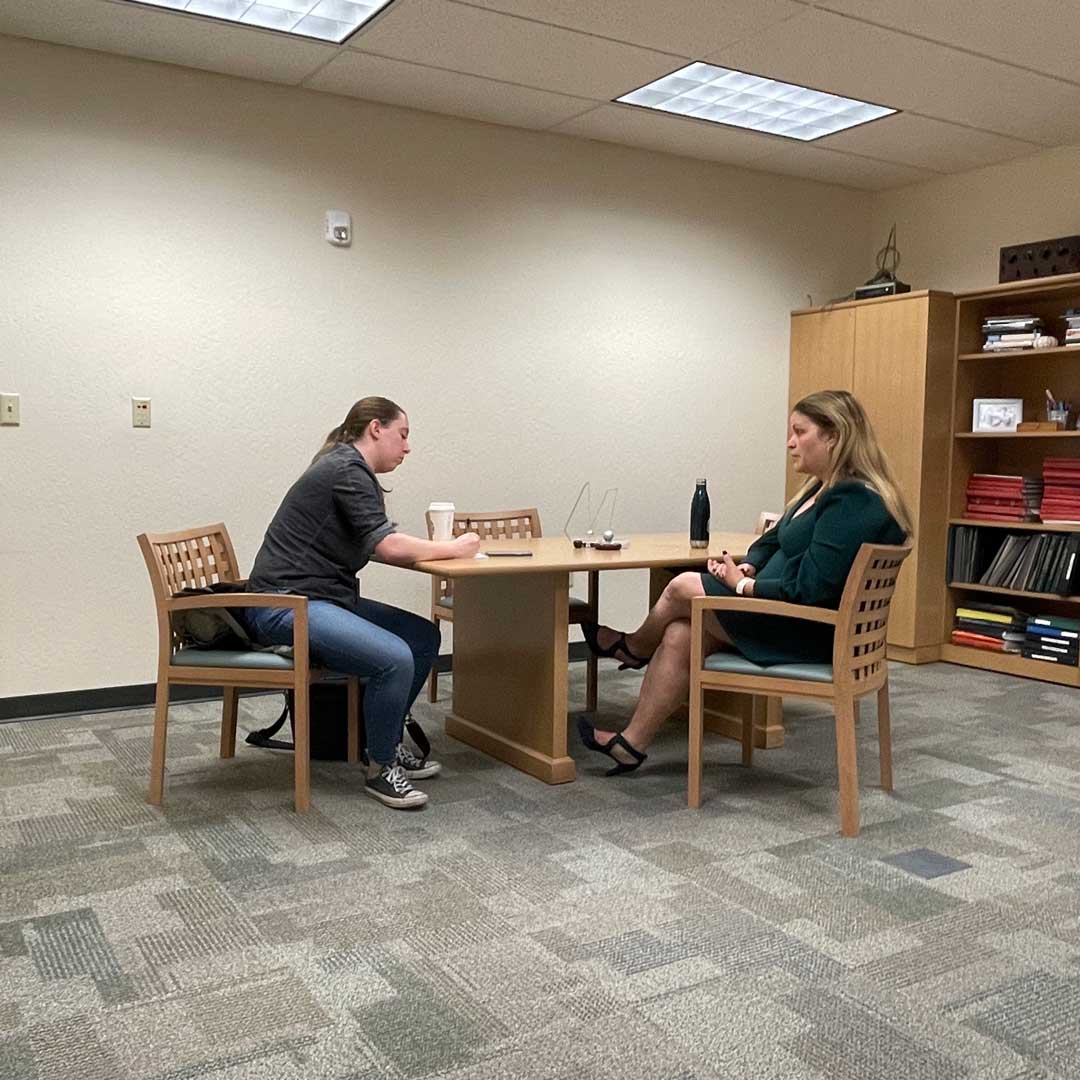 Vanya doing an interview in her office with Monterey Herald reporter Molly Gibbs
