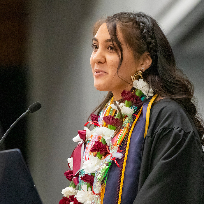 Photo: Latinx grad student speaker at podium