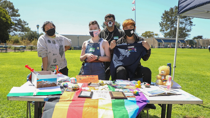 Photo: LGBTQ student club members tabling at an event