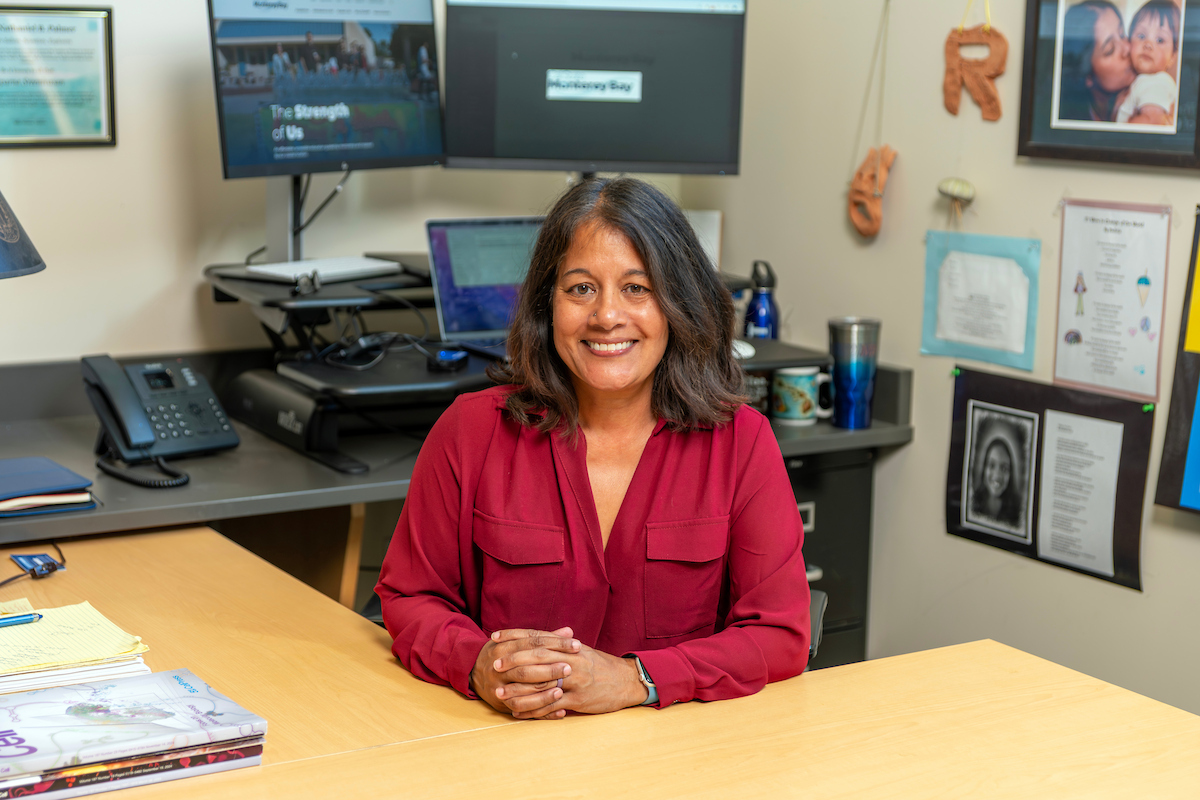 A portrait of a professor smiling at the camera
