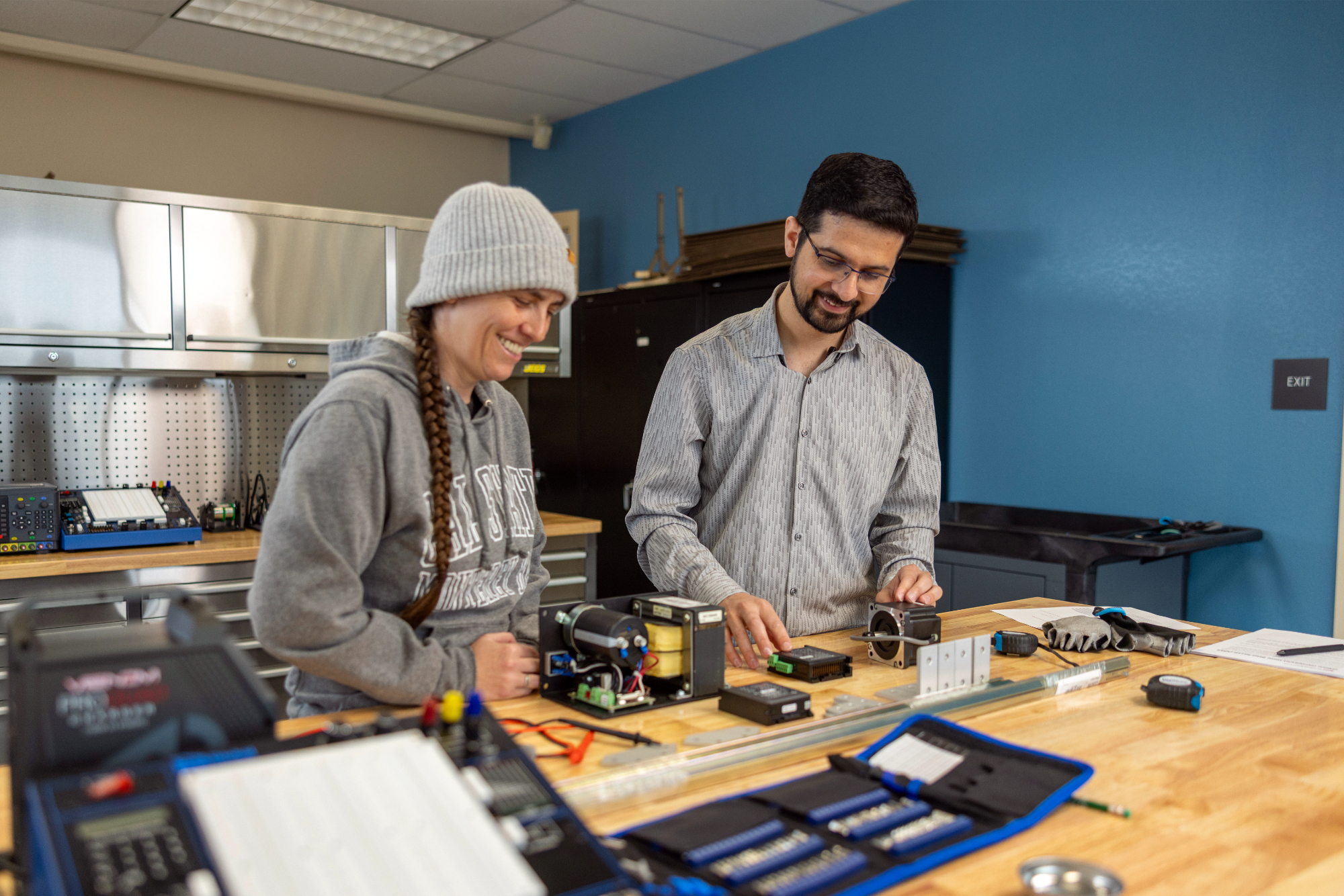 A mechatronics student collaborating with a professor