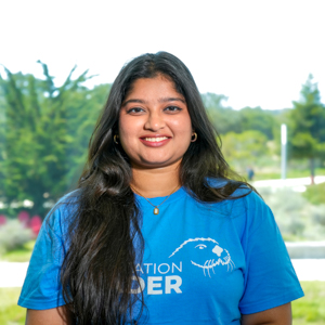 Portrait of an orientation leader standing outdoors on campus.