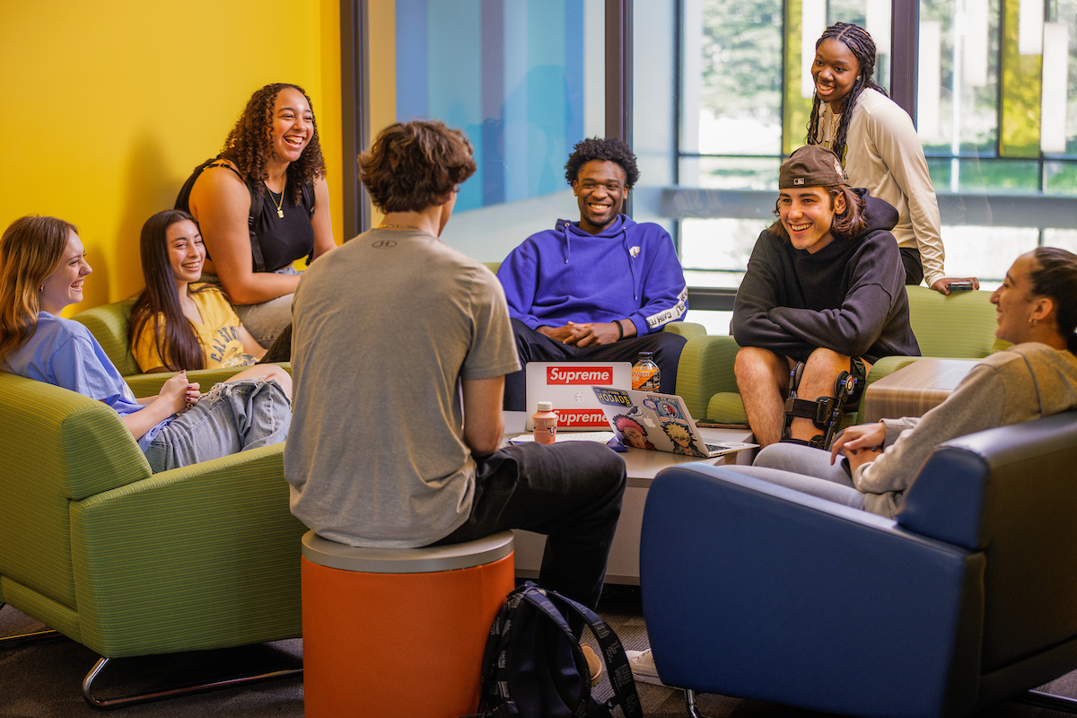 Students sitting in the lounge conversing
