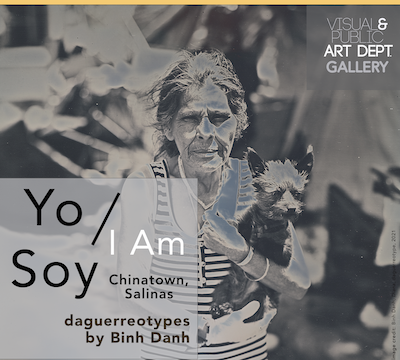 woman carries small dog in chinatown, salinas ca