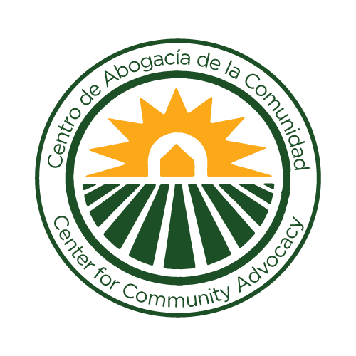 yellow sunset on the horizon over lanes of a green field