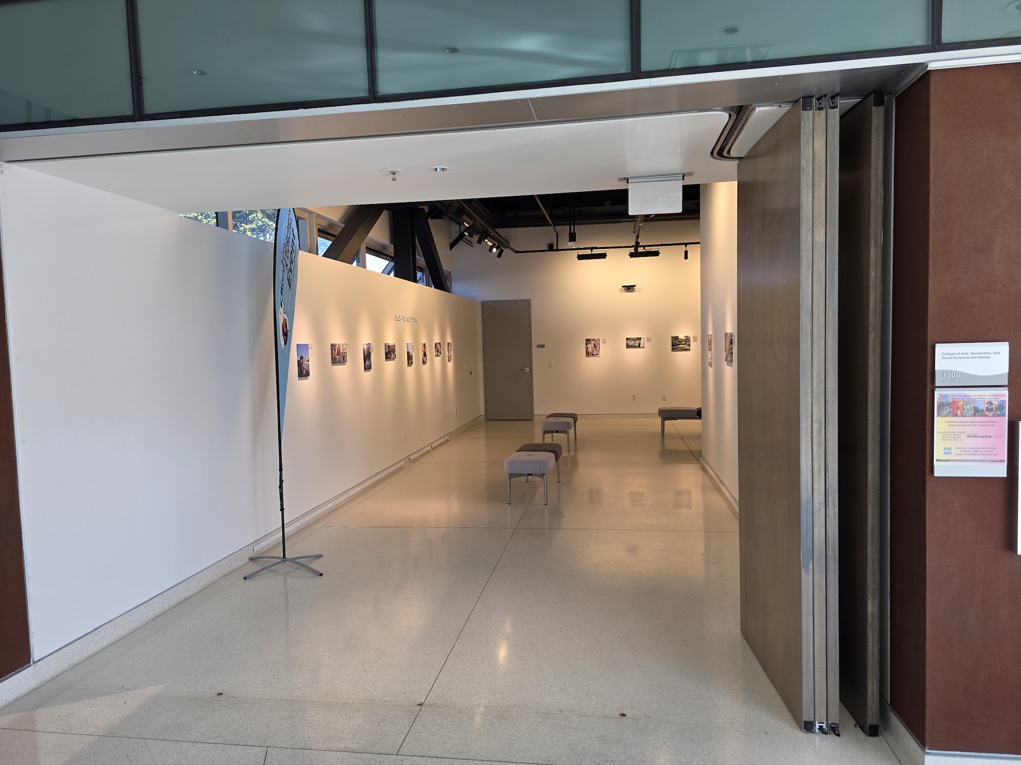View into art gallery featuring images installed on walls