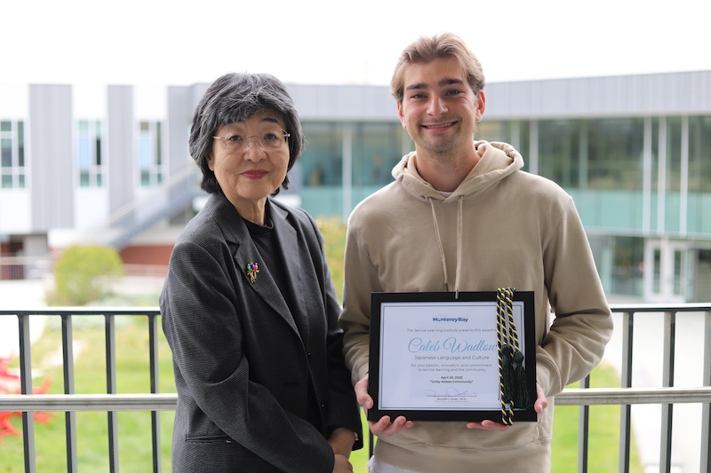 Caleb Wadlow and Dr. Saito-Abbott pose in RND amphitheater