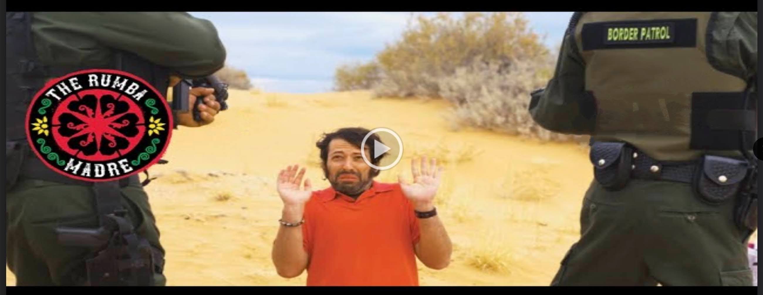 Actor surrendering to border patrol with hands in air