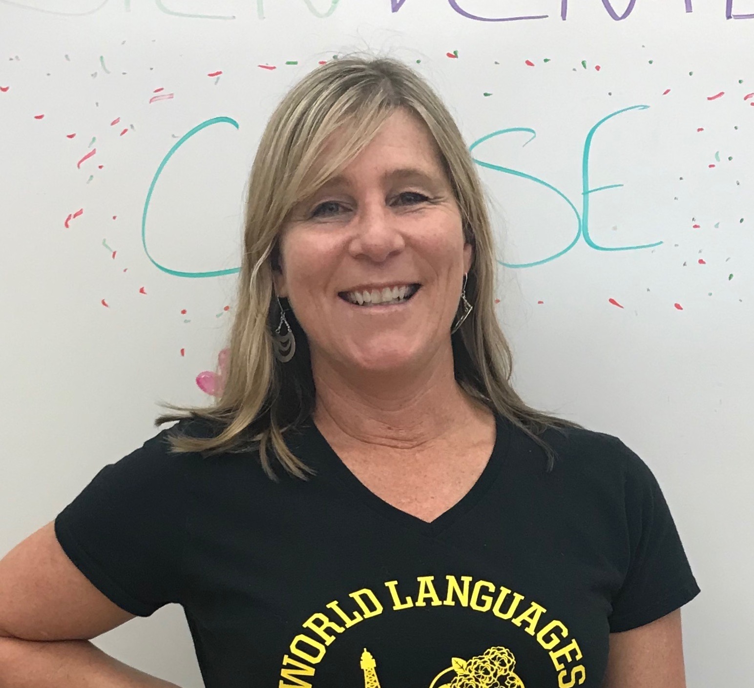 Spanish teacher Michelle Leversee in front of White Board