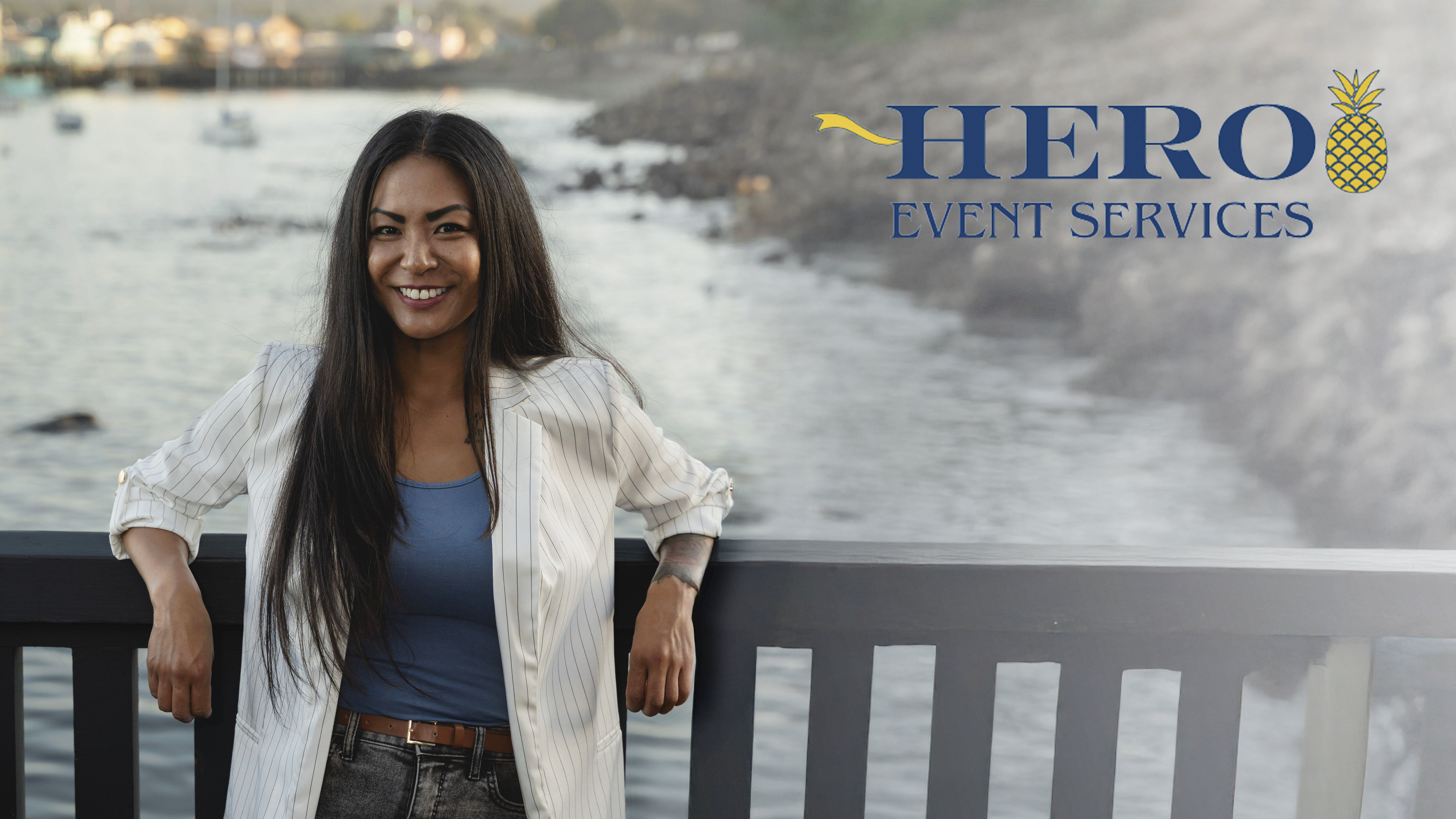 Stephanie Calica, owner of HERO Event Services, smiling and standing beside the HERO Event Services logo.