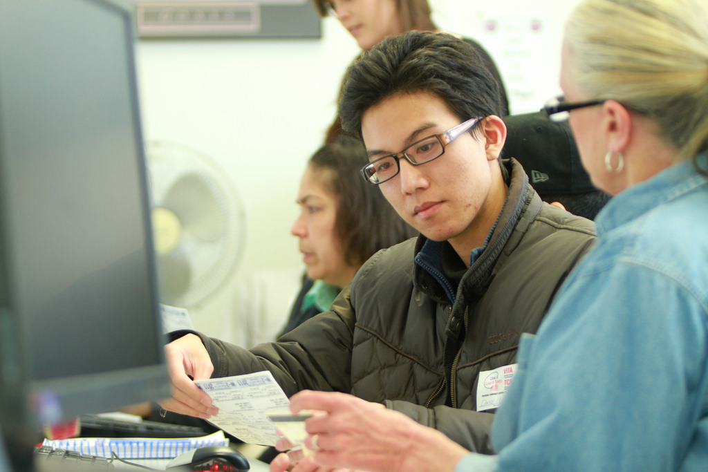 Student reviewing a document with professor