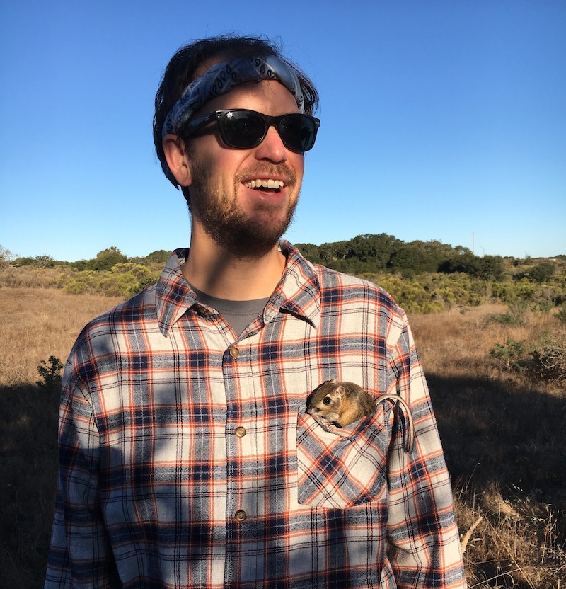 Headshot of Matthew McGee with a small rodent in his front pocket