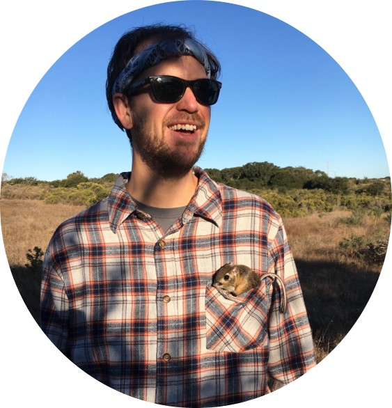 Headshot of Matthew McGee with a small rodent in his left chest pocket