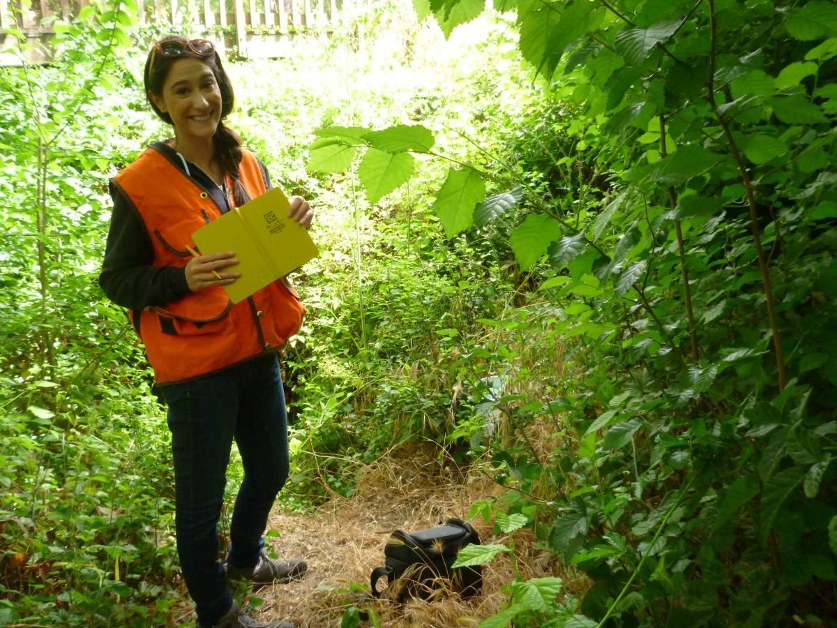 SIP student stands with a clipboard