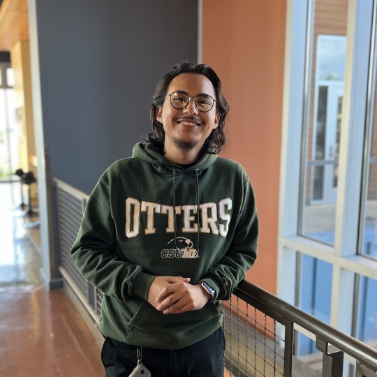 Oscar, a math major, in Chapman, smiling