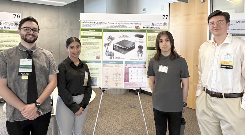 four college students standing in front of their research poster presenting