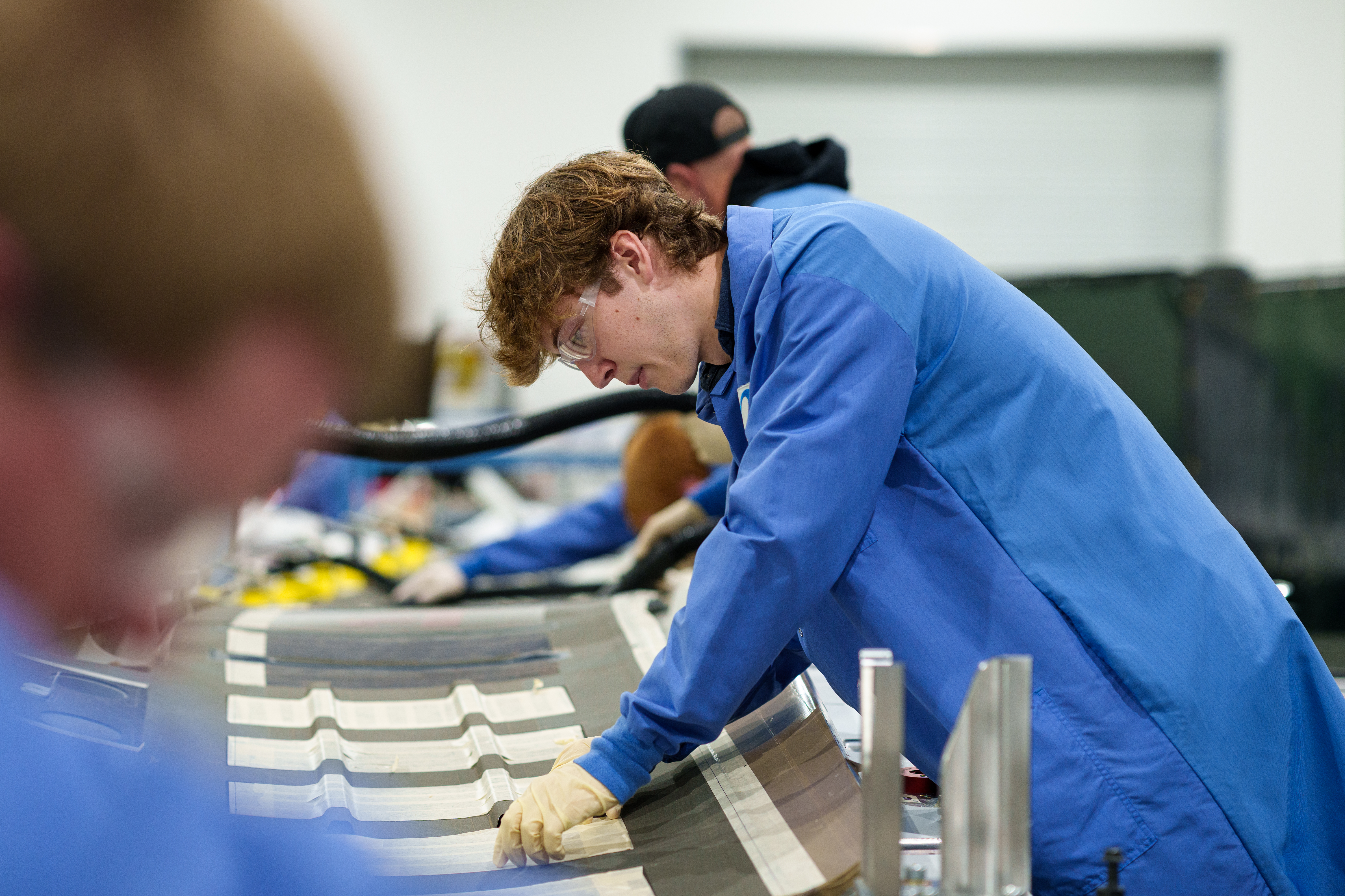 student performing airframe assembly