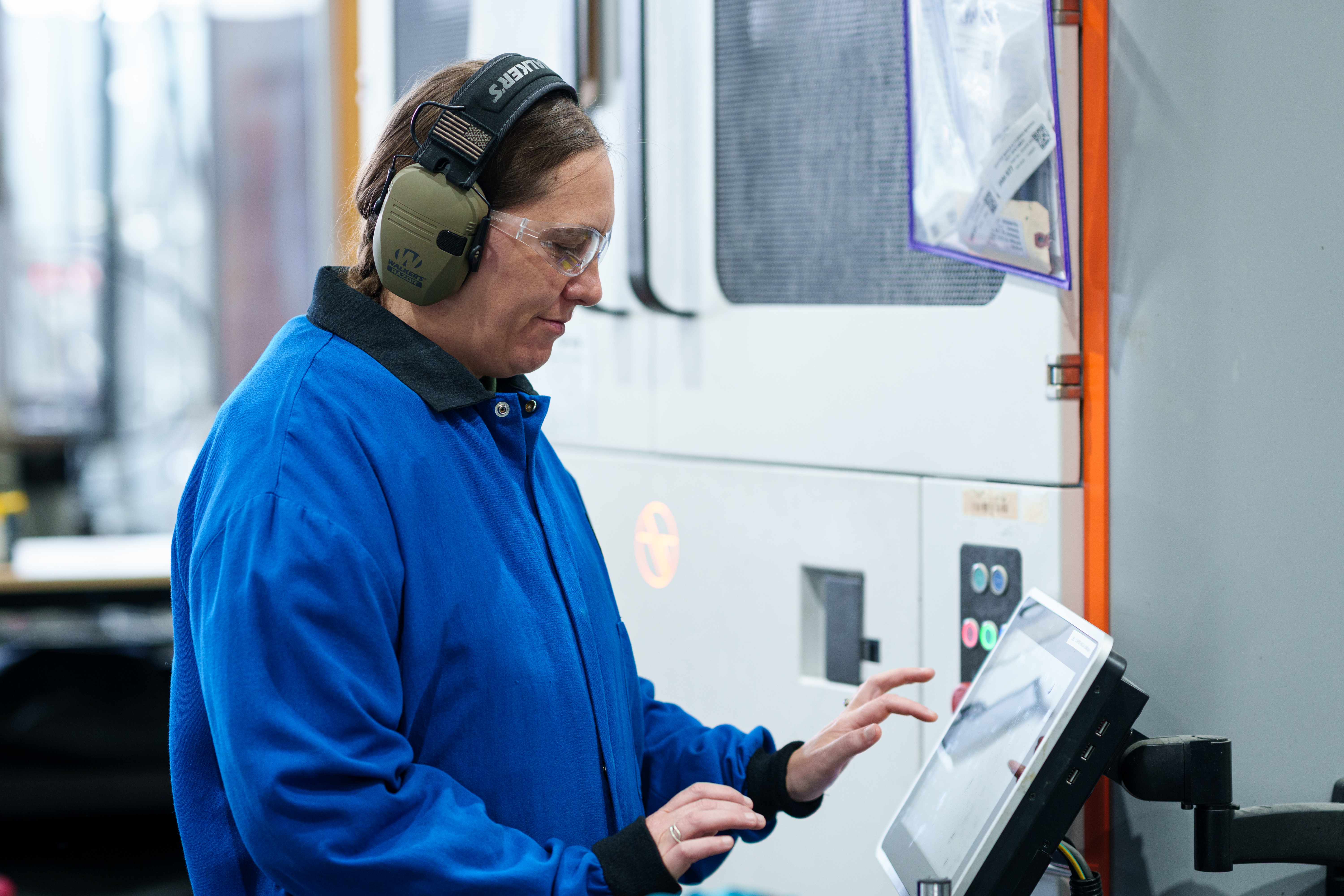 student performing additive manufacturing