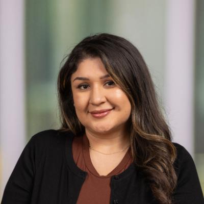 A woman with dark hair smiling