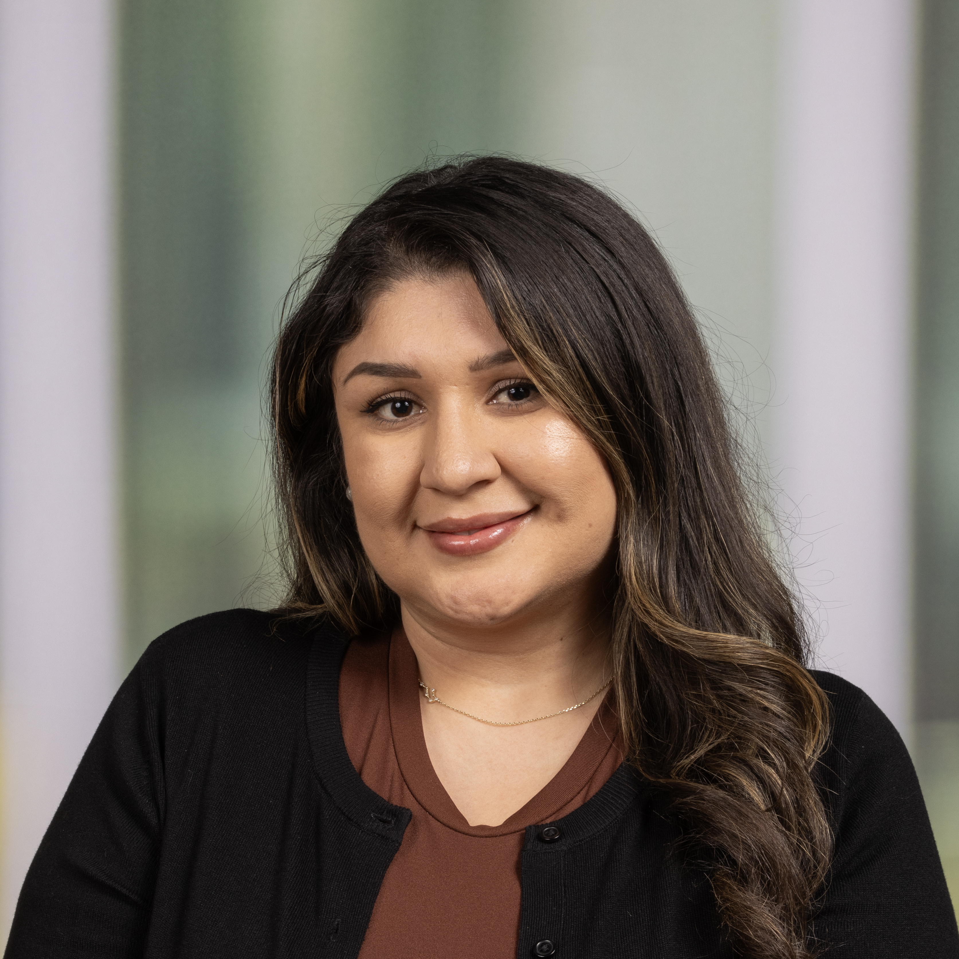 A woman with dark hair smiling