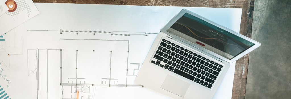 photo of computer and architectural plans