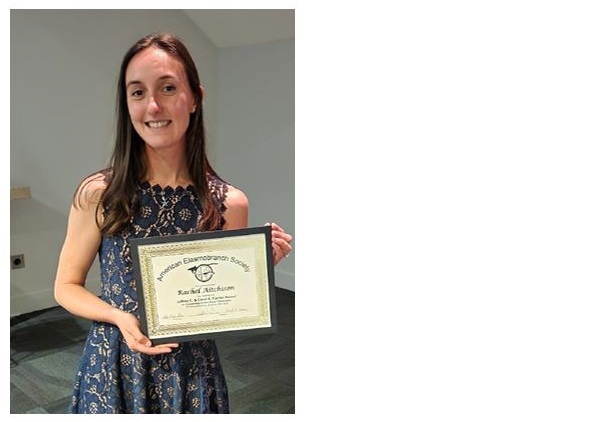 A student holding an award