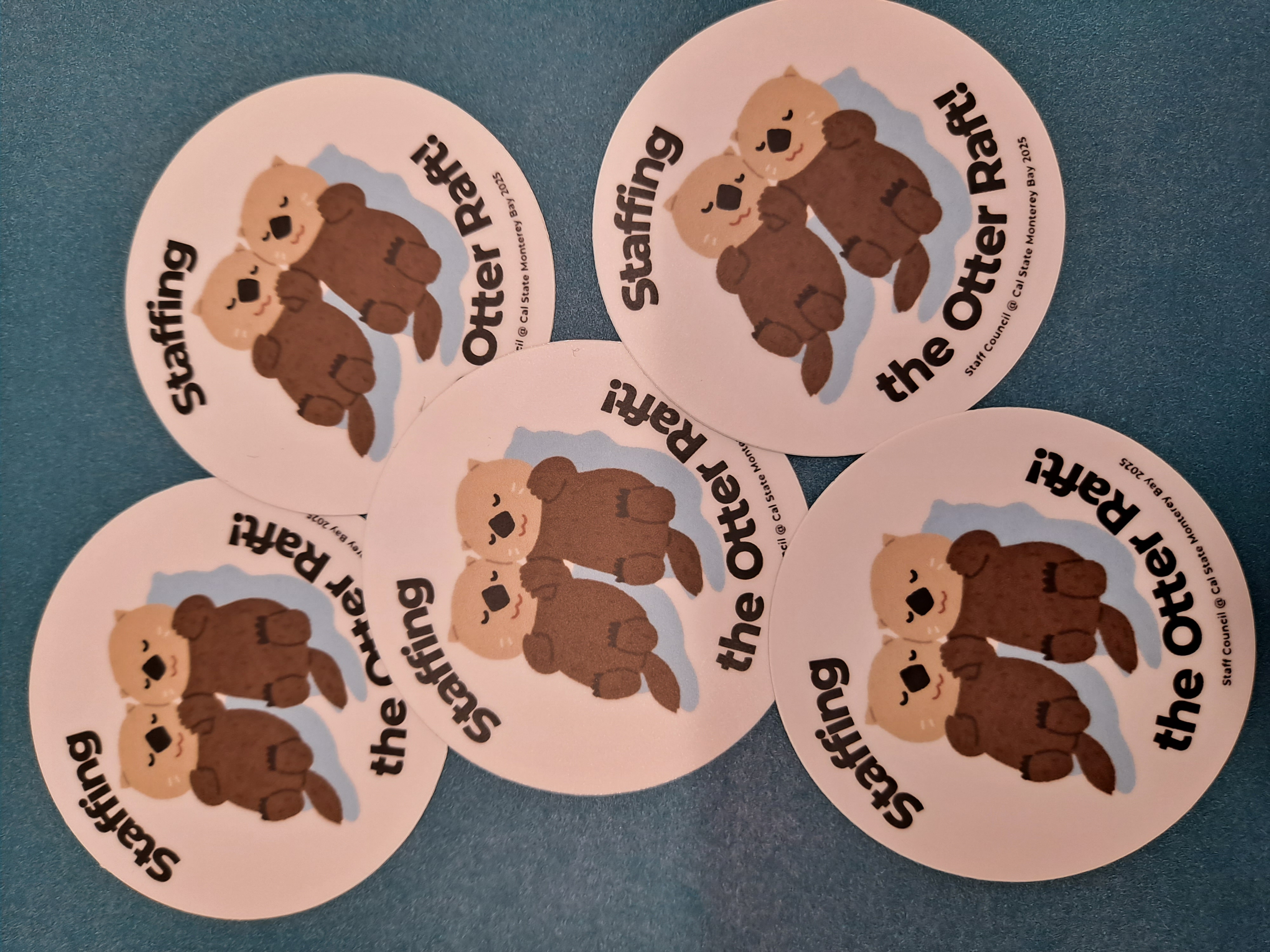 stickers with two otters that reads staffingt he otter raft