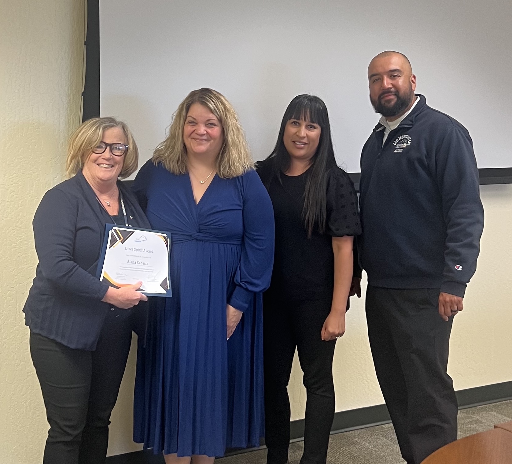 Alana receiving her award.