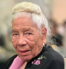 Helen Rucker wearing pink and black attire