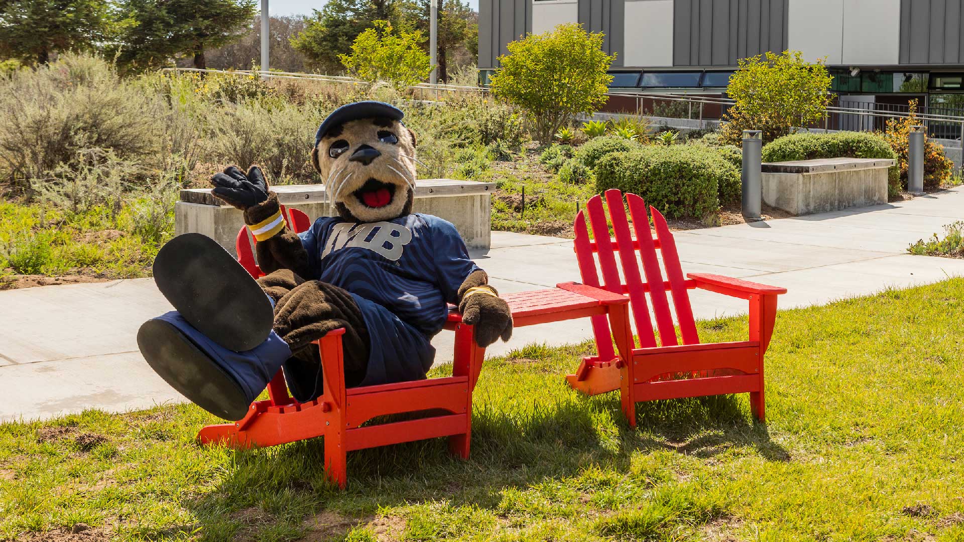 Photo: Monte Rey sitting on a bench in front of OSU