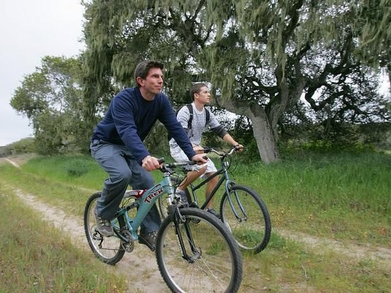 Two people biking