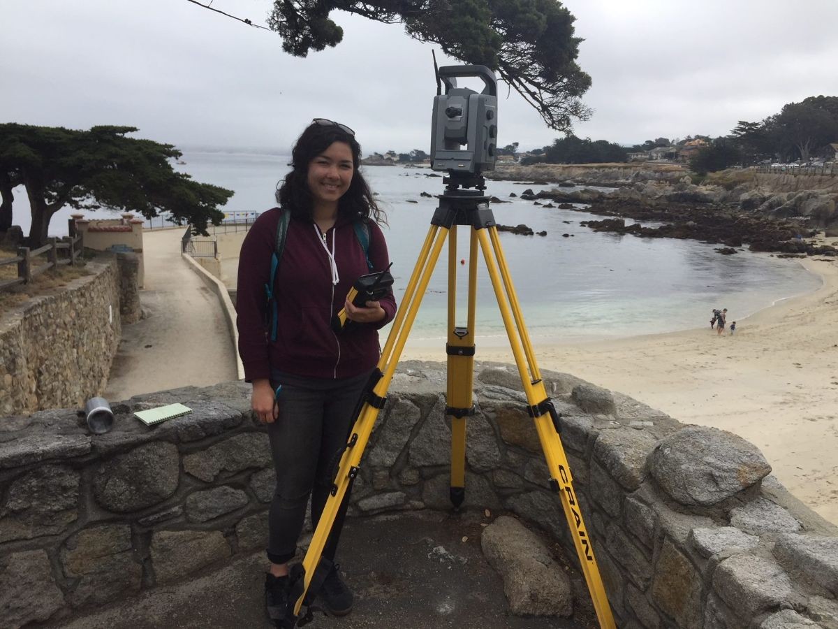 Student surveying geology.