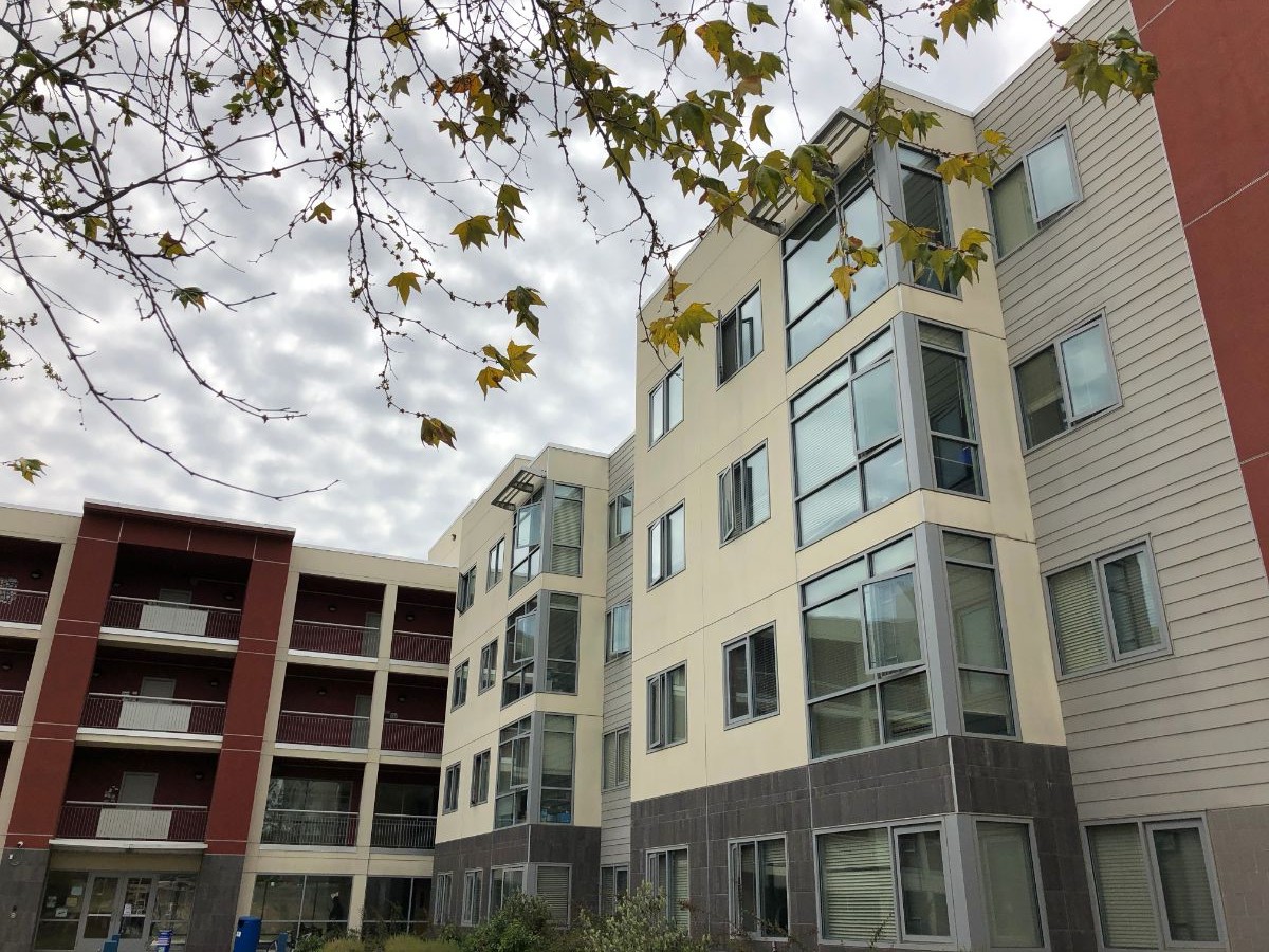 North Quad Suites and Apartments exterior in the fall.