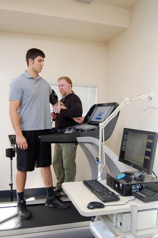 CSUMB student Marcus Lawrence has his vitals checked by professor Dr. Kent Adams in the Kinesiology lab.