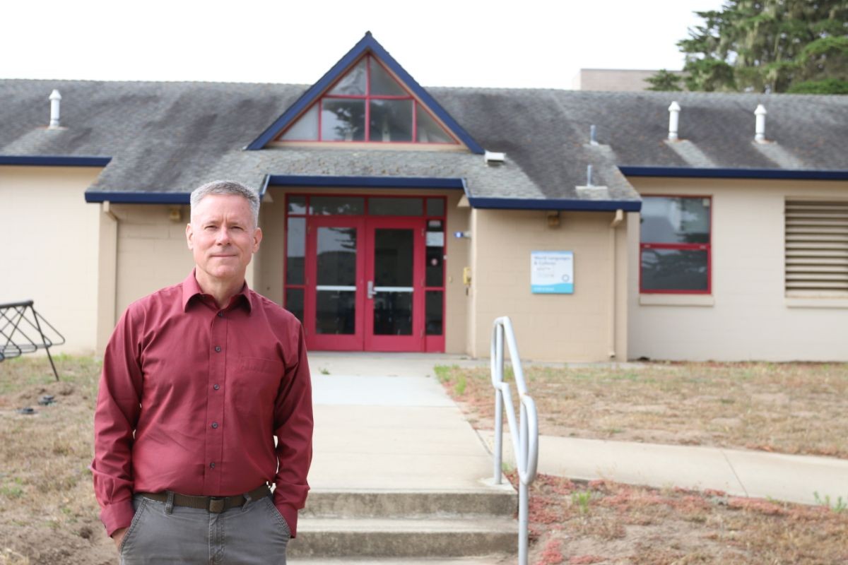 John Olson in front of former battalion headquarters building.