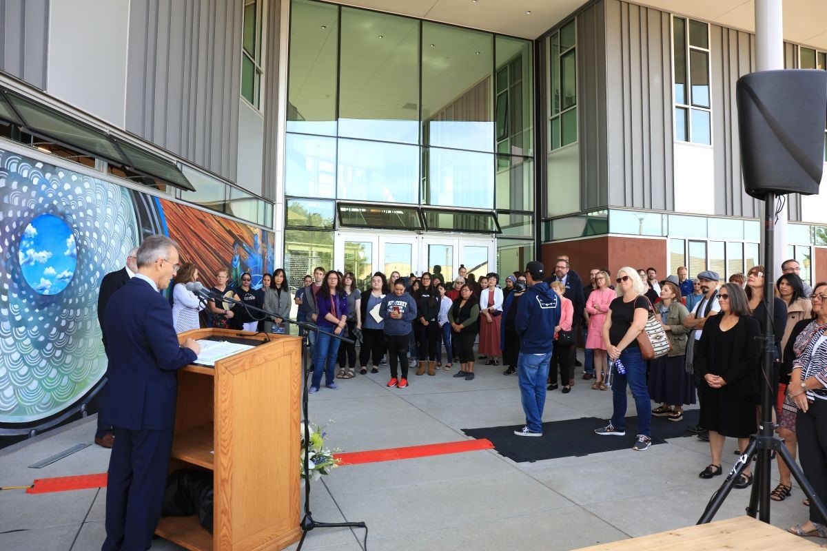 President Eduardo M. Ochoa addresses the crowd gathered outside the new CAHSS building for a ribbon cutting ceremony in October 2019.