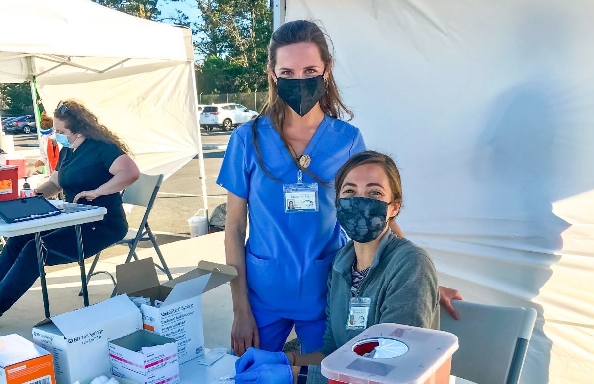 Physician assistant students Katy Yagorva and Ashley Miller were among the volunteers providing vital assistance at a Monterey County vaccine clinic at CSUMB.