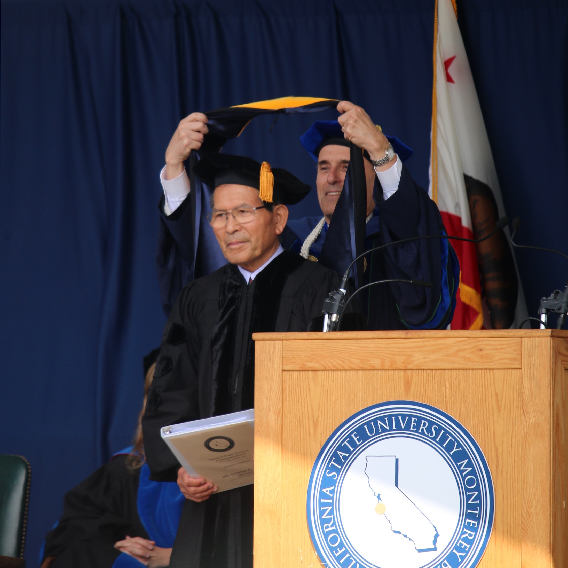 Andy Matsui is awarded an honorary Doctorate of Science for his dedication to furthering public education.