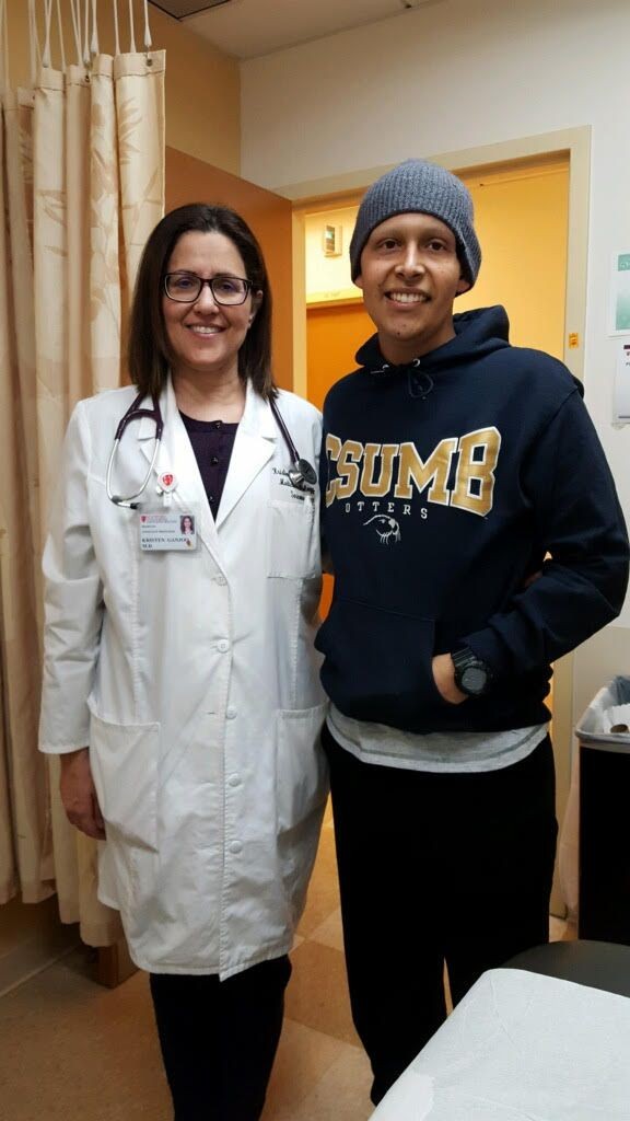 Martin at age 23 with his oncologist Dr. Kristen Nooshin Ganjoo in 2018.