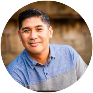 Male with denim shirt outdoors headshot