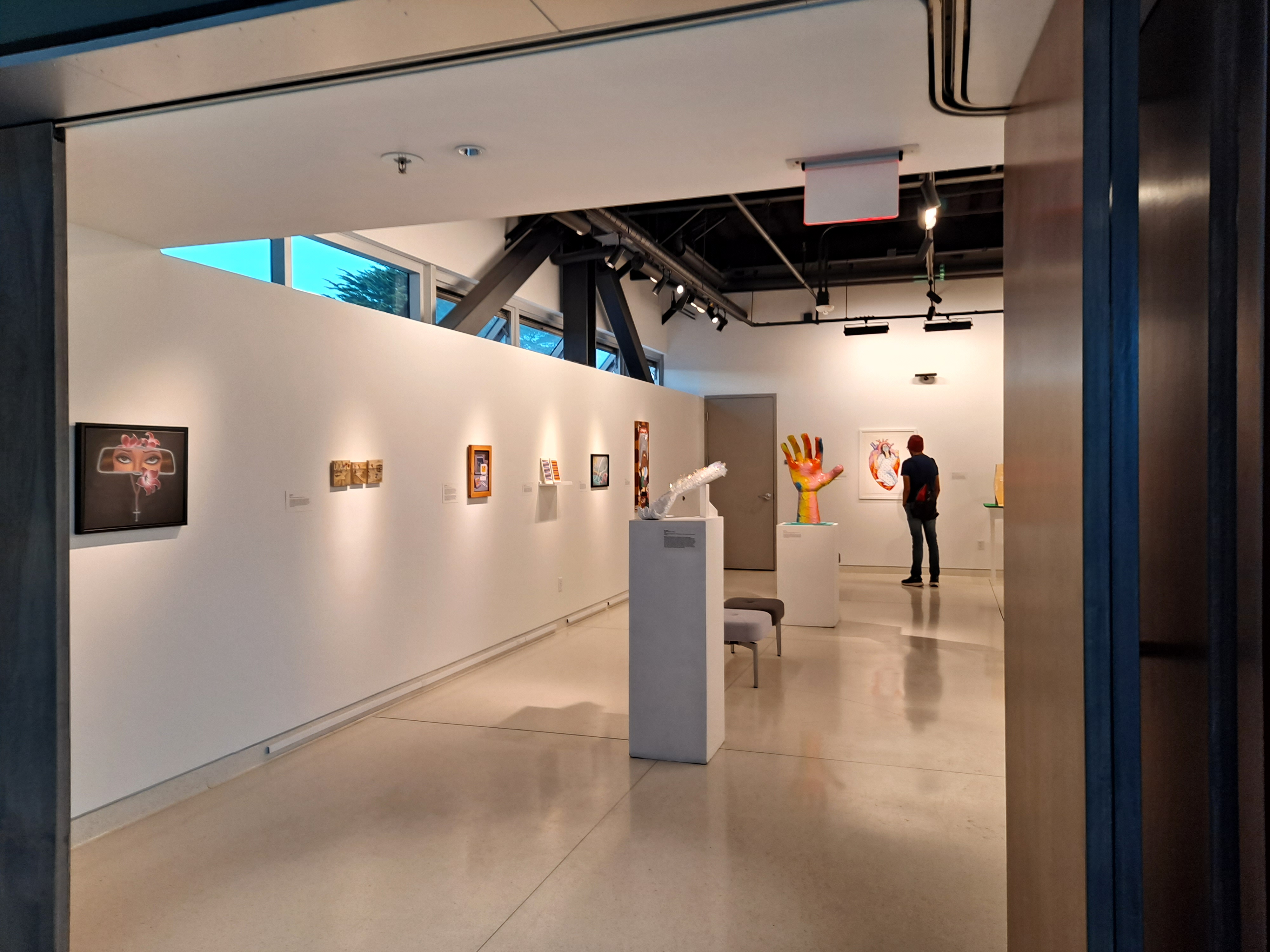 a student enjoys art in the gallery