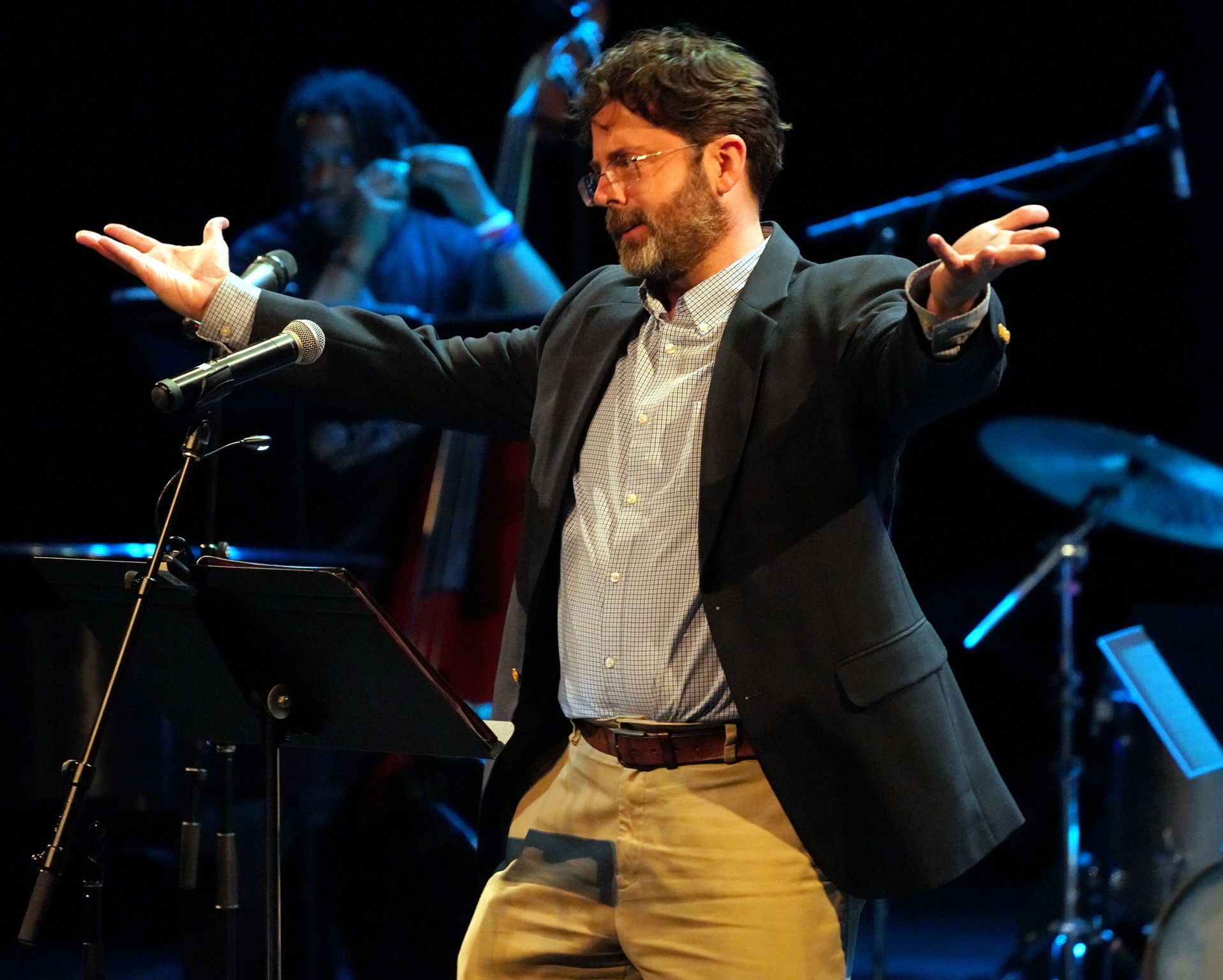 man (jeff jones) gestures to crowd with open hands