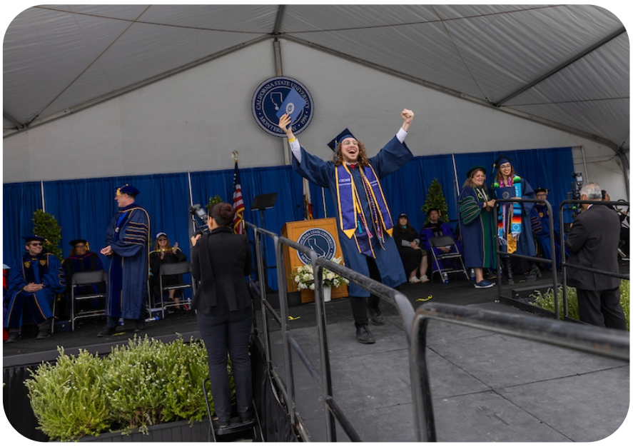 student celebrating receiving college degree
