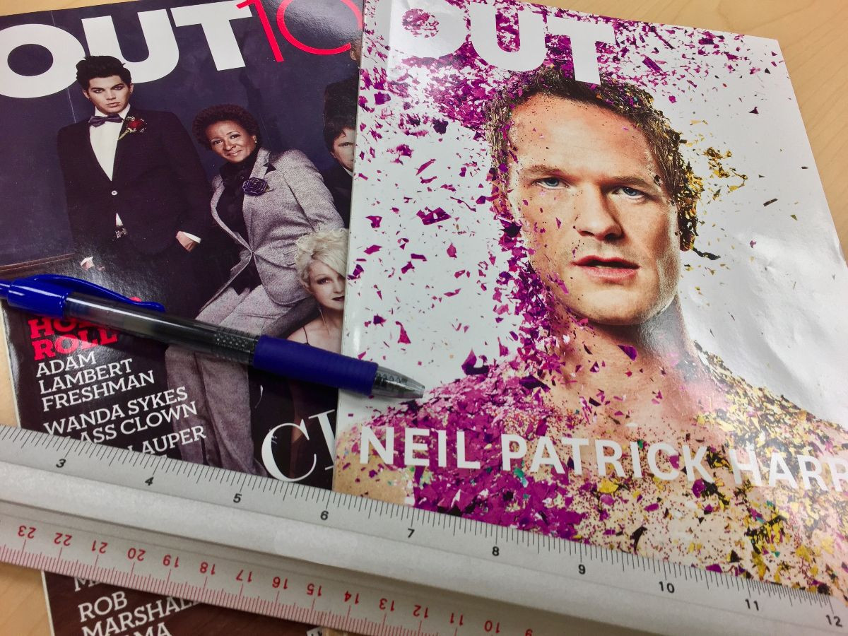 magazine covers and rulers sitting on a table in the lab