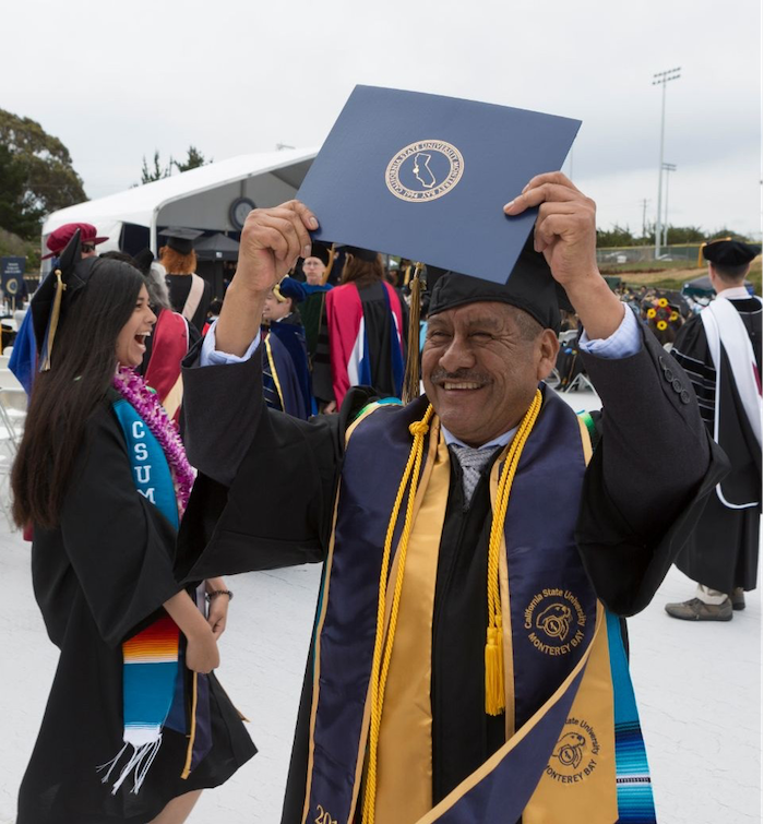 Adolfo Gonzalez celebrates at commencement ceremony 2018 with diploma in hand